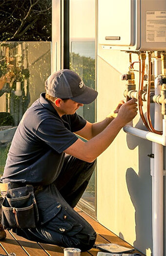 Plumber Working Water Heater